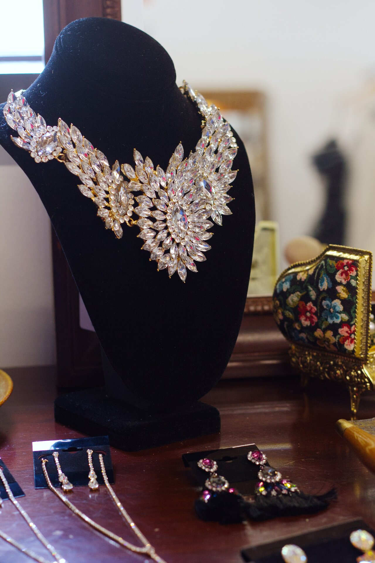 A display of wedding accessories including necklaces and earrings.