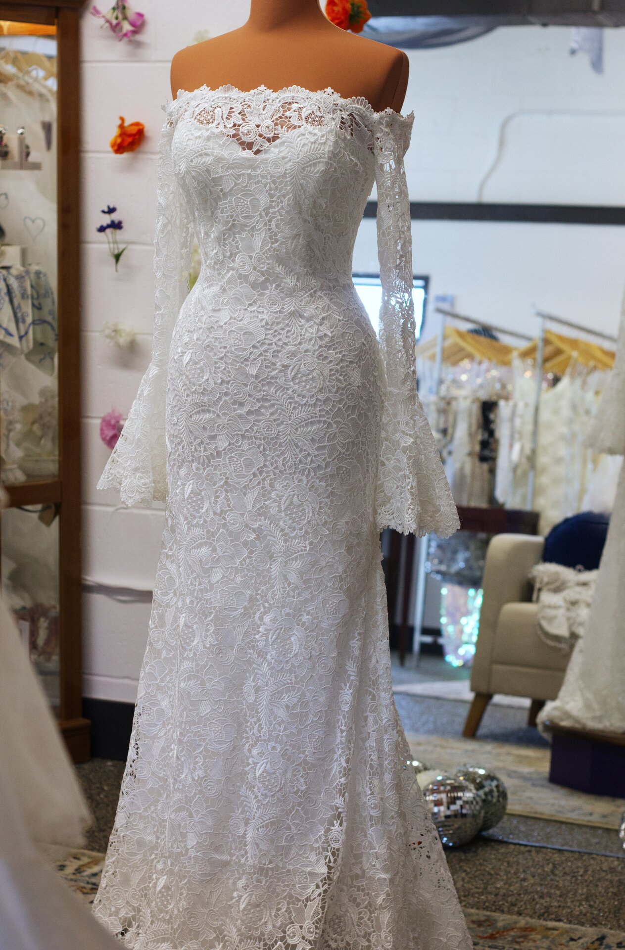 A full-length lace wedding dress.