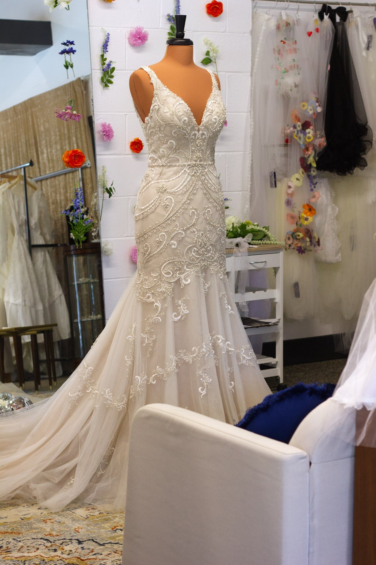 A long fit-and-flare wedding dress with intricate beaded details.