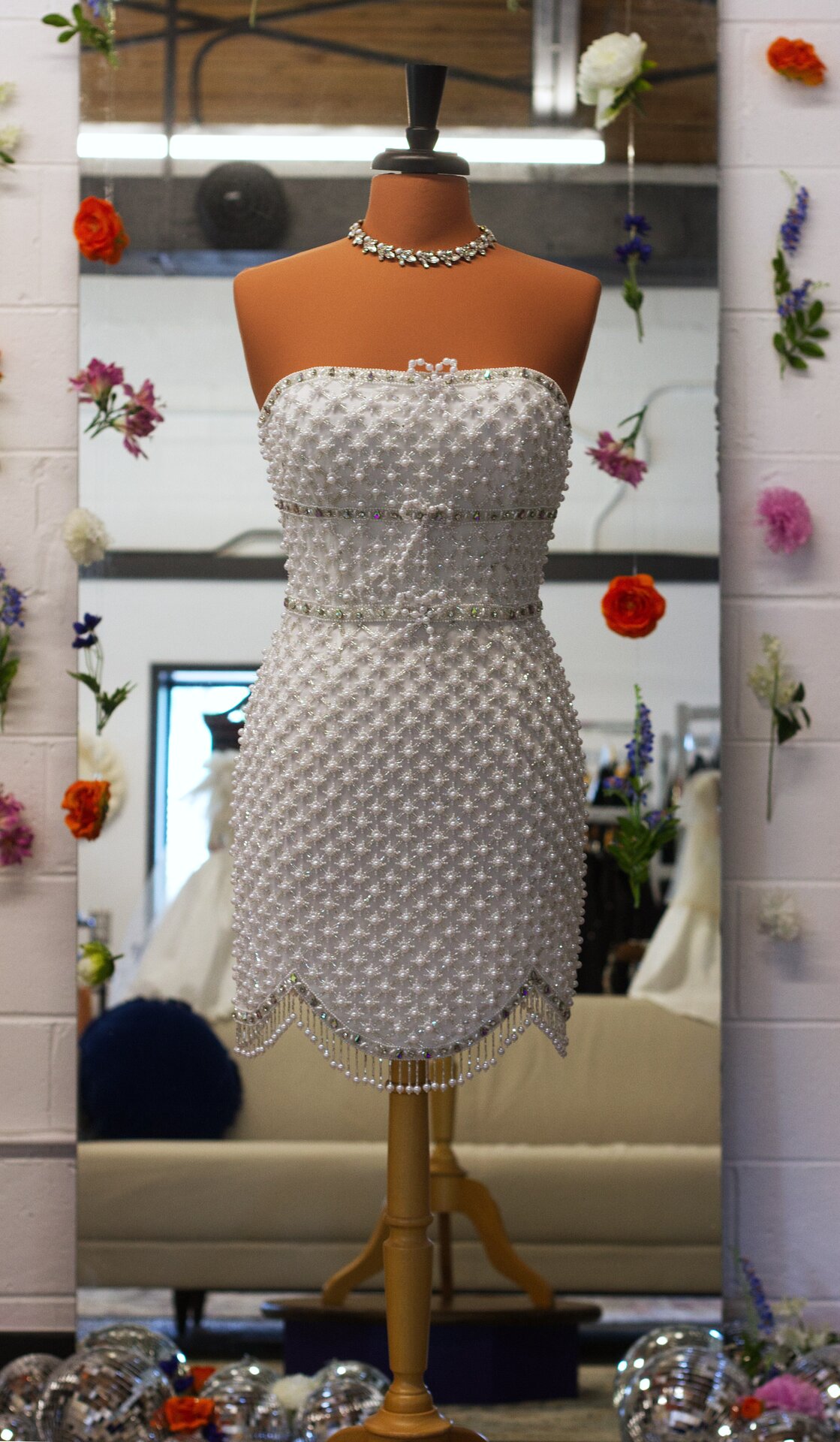 A short beaded wedding dress.