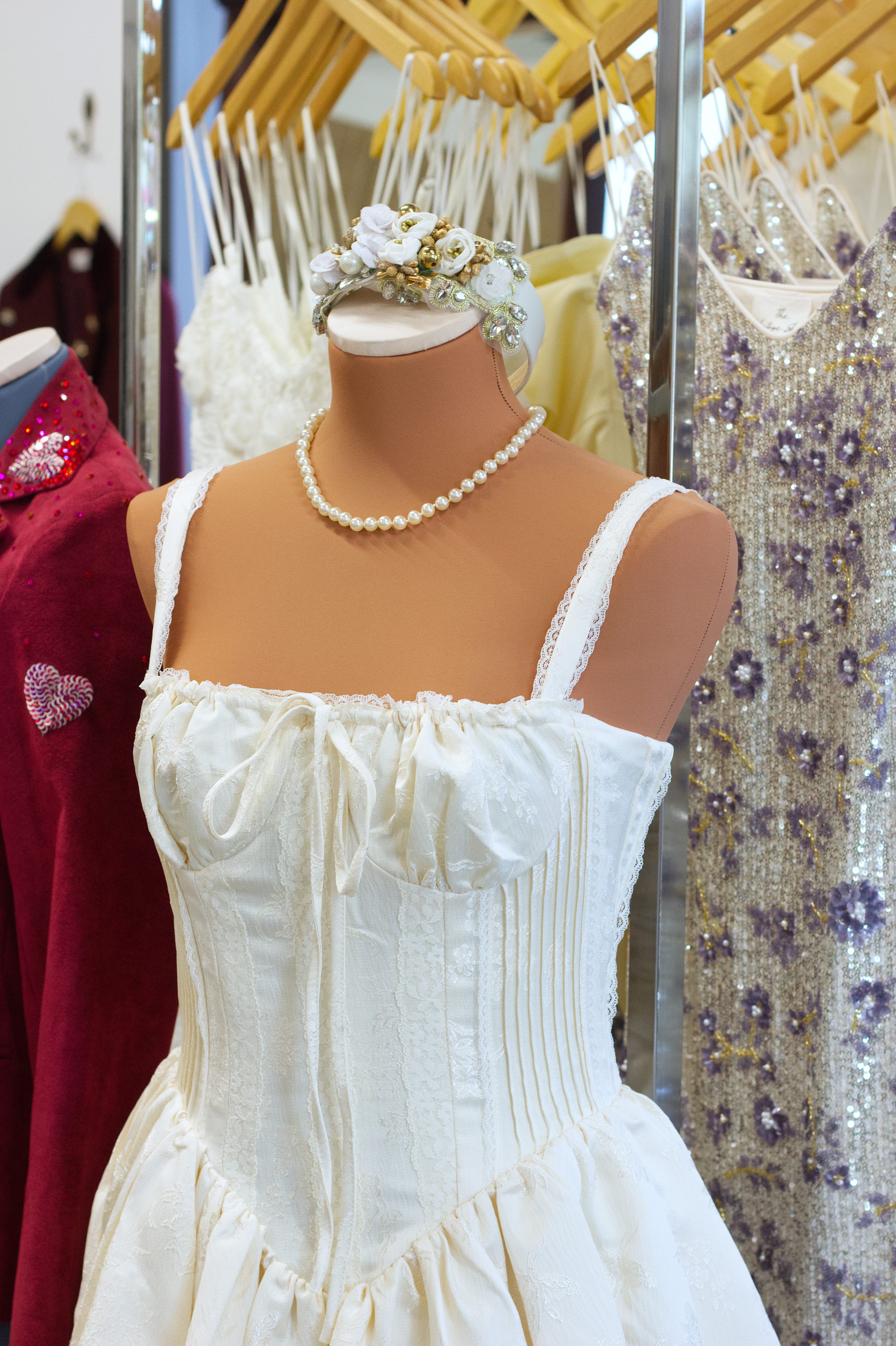A white wedding dress on a mannequin in the store